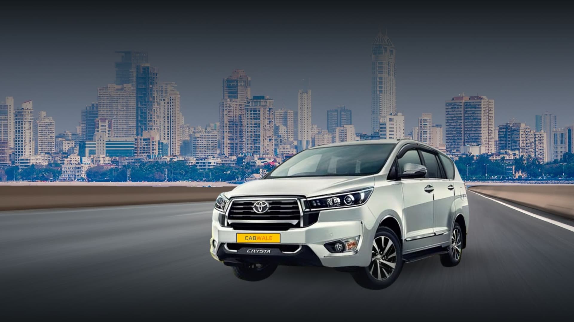 A white Toyota Innova Crysta driving on a highway with a city skyline featuring tall buildings in the background. The car has a "CAB WALE" sign on the front license plate.